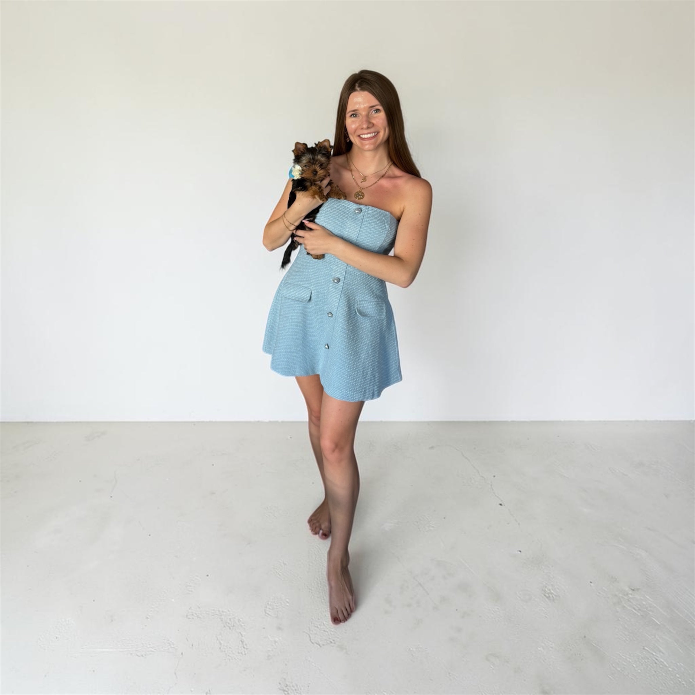 Model wearing SOVRA Los Angeles BLUE blazer with peplum basque, proudly made in USA with puppy